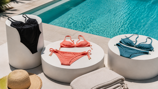 Stylish bathing suits displayed beside a bright modern pool