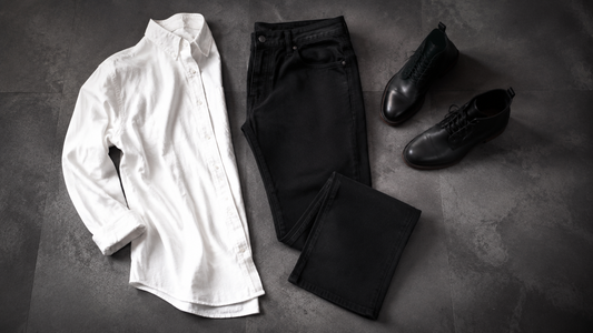 Men's black jeans styled with a white shirt and boots