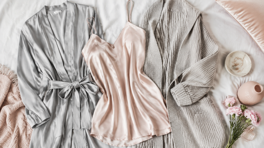 Soft-grey and blush camisole robe and cardigan arranged with accessories