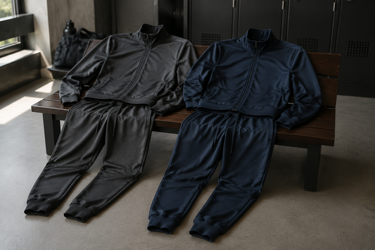 Men's tracksuits in charcoal and navy with zip jackets and tapered pants