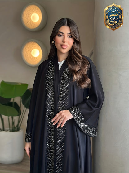 عباءة كارديجان فضفاضة بتصميم أنيق للمرأة العربية في رمضان، بتفاصيل ماسية مجعدة ولون أسود من موضة دبي
