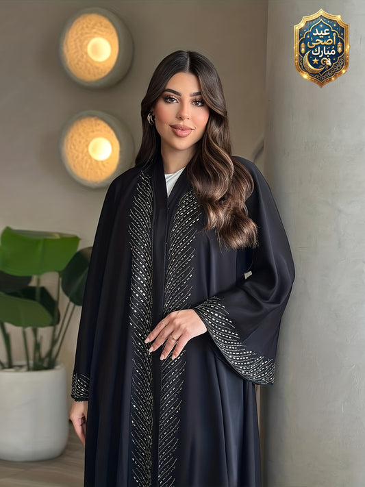 عباءة كارديجان فضفاضة بتصميم أنيق للمرأة العربية في رمضان، بتفاصيل ماسية مجعدة ولون أسود من موضة دبي